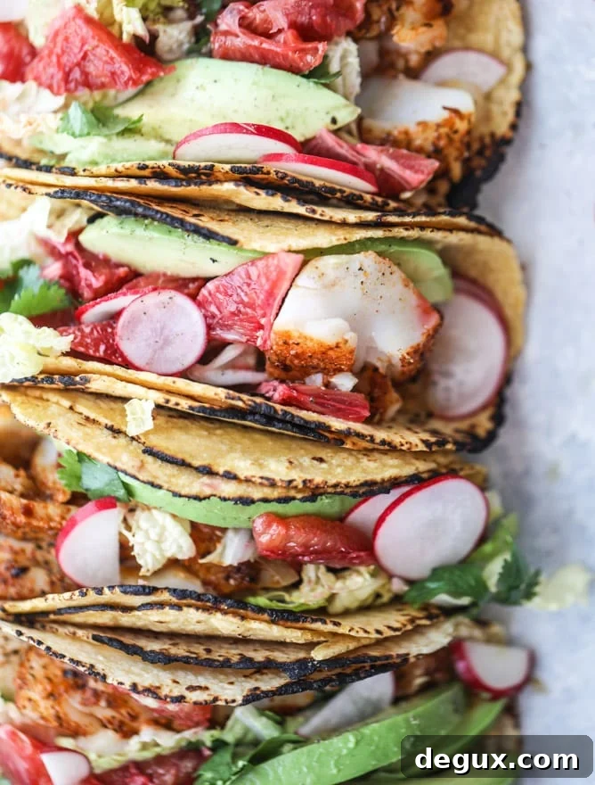 Cajun Fish Tacos with Zesty Blood Orange Slaw 9 cajun fish tacos with blood orange slaw I howsweeteats.com #fishtacos #tacos #bloodorange #fish