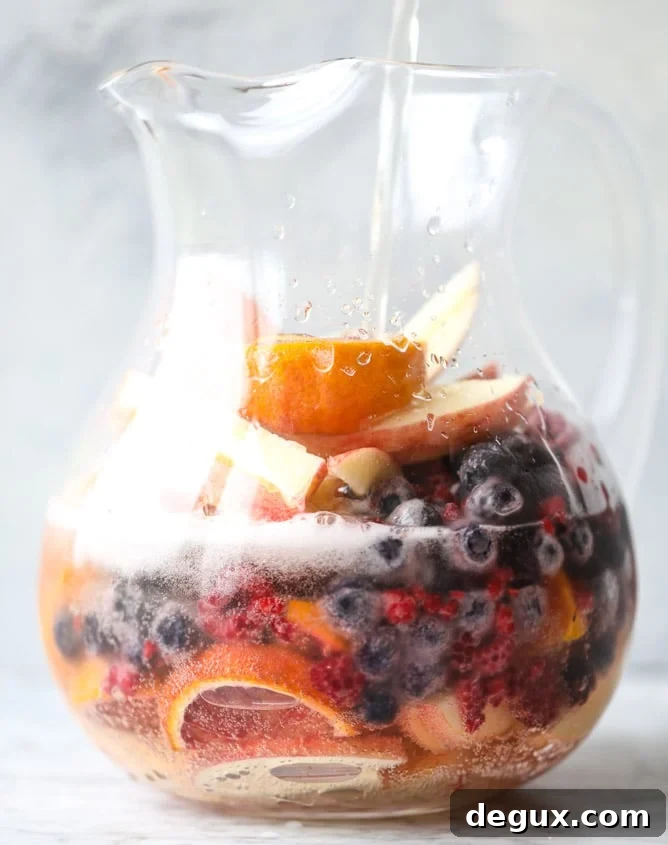 Kombucha Sangria Recipe: Sparkling Fruit Punch with Probiotic Twist 3 kombucha sangria I howsweeteats.com #kombucha #sangria #cocktails