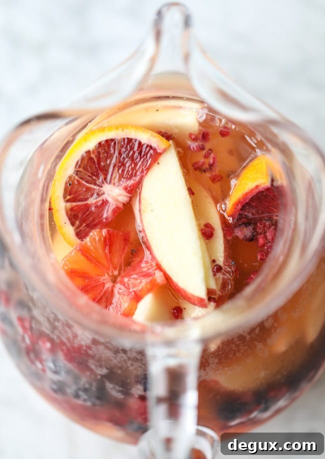 Kombucha Sangria Recipe: Sparkling Fruit Punch with Probiotic Twist 4 kombucha sangria I howsweeteats.com #kombucha #sangria #cocktails