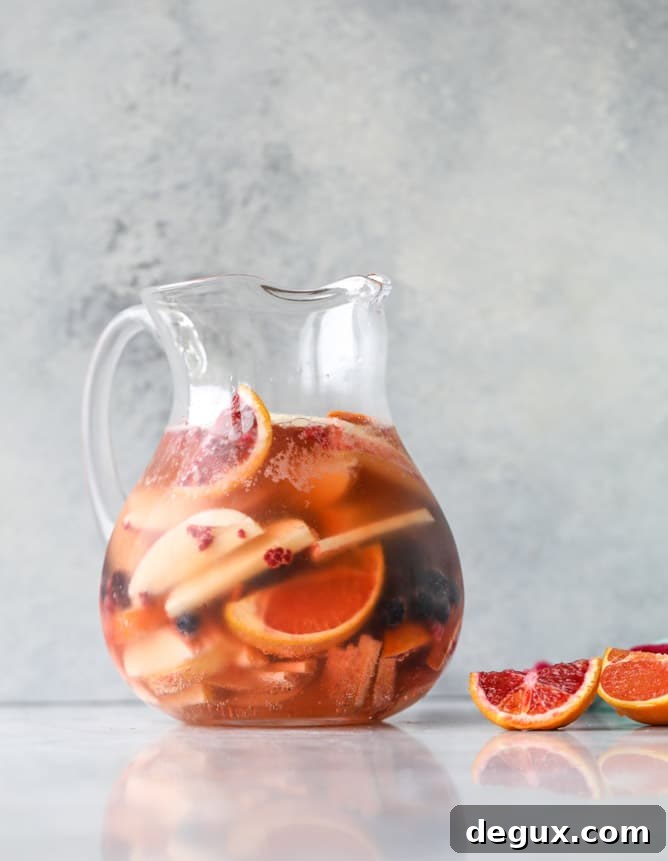 Kombucha Sangria Recipe: Sparkling Fruit Punch with Probiotic Twist 5 kombucha sangria I howsweeteats.com #kombucha #sangria #cocktails