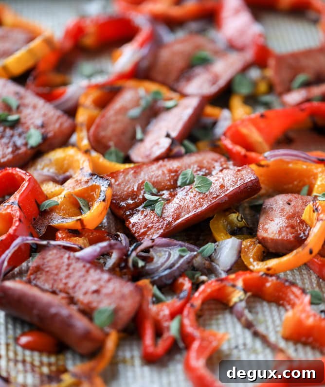 Smoky Sheet Pan Sausage and Peppers Recipe 2 sheet pan smoked sausage and peppers I howsweeteats.com #sheetpan #smoked #sausage #turkey #healthy