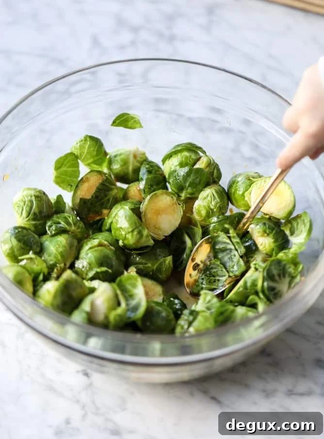sheet pan honey garlic salmon and brussels I howsweeteats.com #sheetpan #salmon #honeygarlic #brusselssprouts