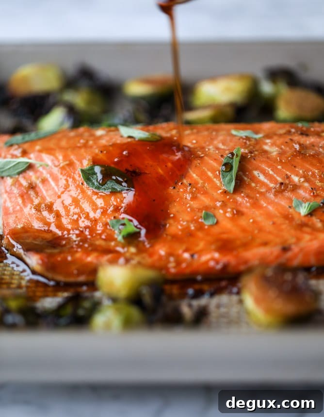 sheet pan honey garlic salmon and brussels I howsweeteats.com #sheetpan #salmon #honeygarlic #brusselssprouts