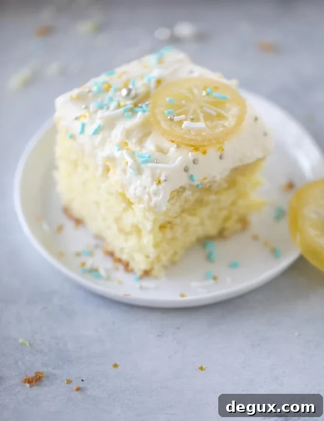 Lemon Sheet Cake with Cream Cheese Frosting Recipe 2 lemon sheet cake with cream cheese frosting I howsweeteats.com #lemon #cake #sheetcake #dessert #creamcheesefrosting