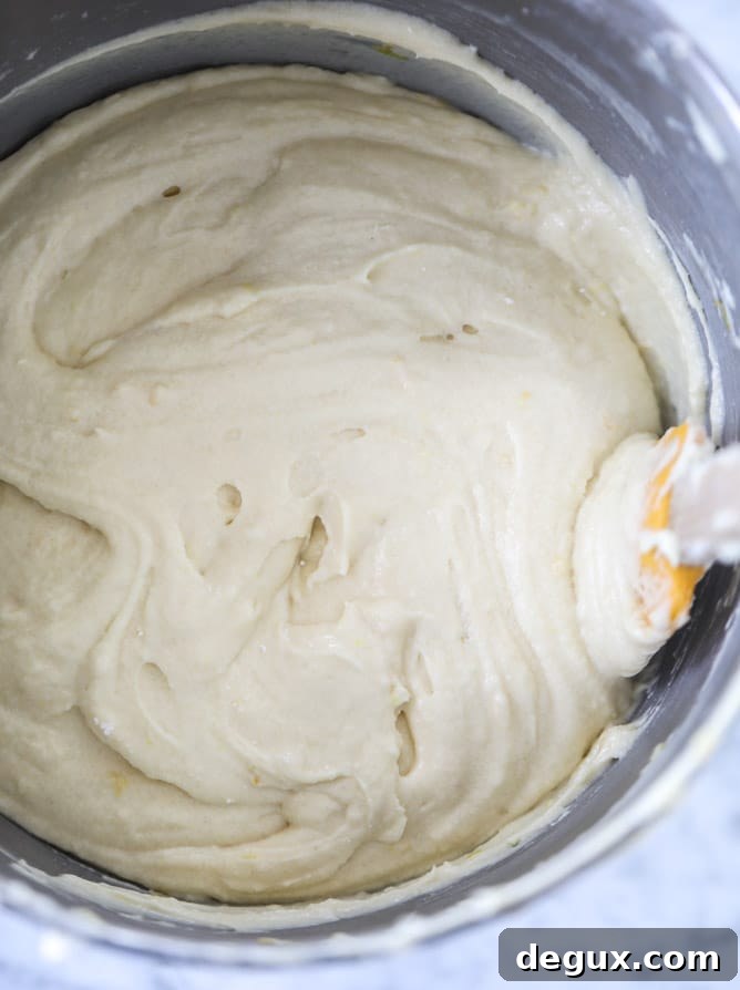 Lemon Sheet Cake with Cream Cheese Frosting Recipe 3 lemon sheet cake with cream cheese frosting I howsweeteats.com #lemon #cake #sheetcake #dessert #creamcheesefrosting