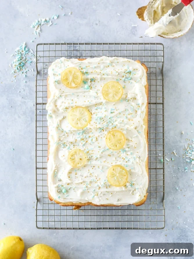 Lemon Sheet Cake with Cream Cheese Frosting Recipe 7 lemon sheet cake with cream cheese frosting I howsweeteats.com #lemon #cake #sheetcake #dessert #creamcheesefrosting