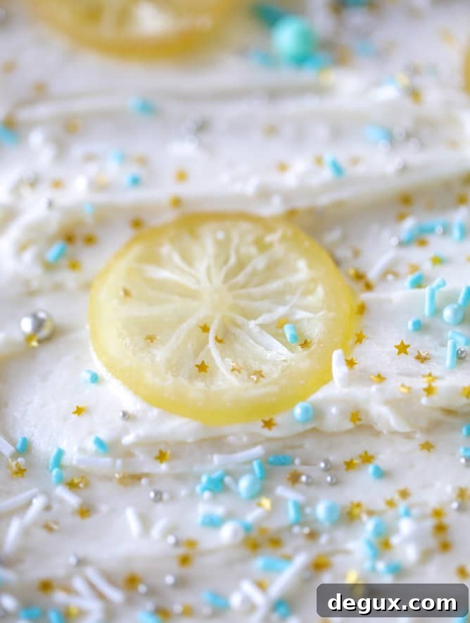Lemon Sheet Cake with Cream Cheese Frosting Recipe 8 lemon sheet cake with cream cheese frosting I howsweeteats.com #lemon #cake #sheetcake #dessert #creamcheesefrosting