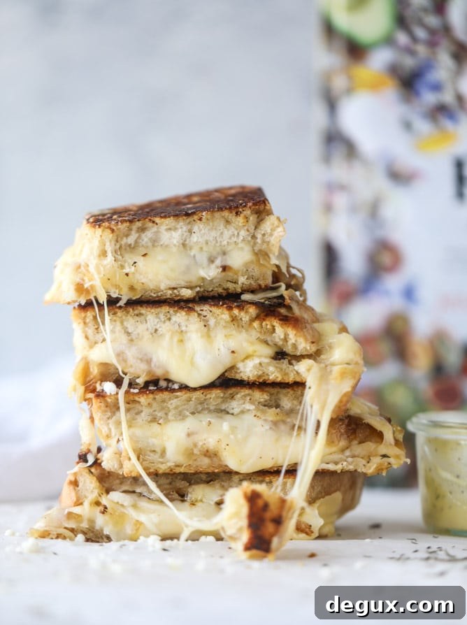 french onion grilled cheese with thyme butter I howsweeteats.com #grilledcheese #caramelizedonion #vegetarian