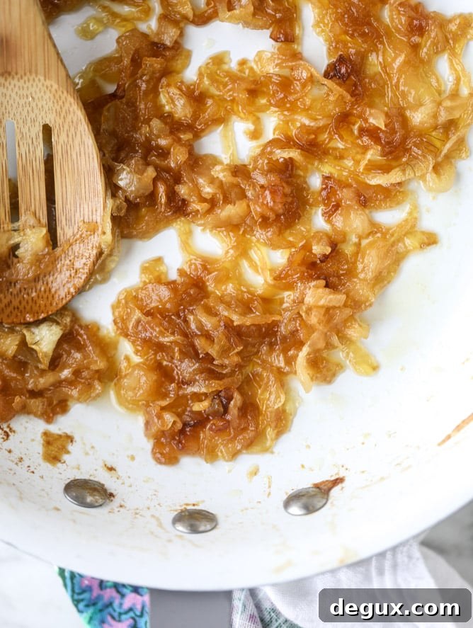 french onion grilled cheese with thyme butter I howsweeteats.com #grilledcheese #caramelizedonion #vegetarian