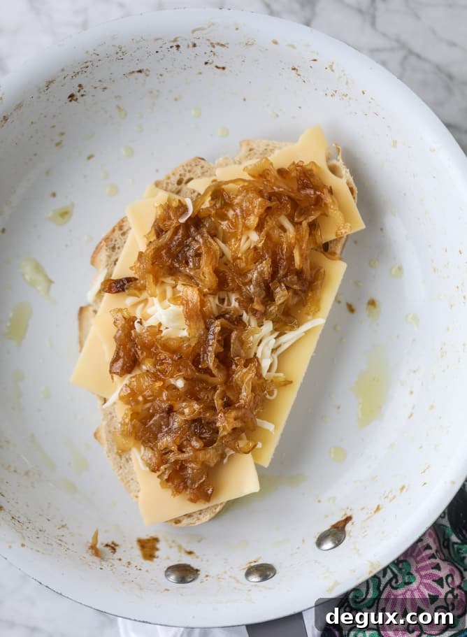 french onion grilled cheese with thyme butter I howsweeteats.com #grilledcheese #caramelizedonion #vegetarian