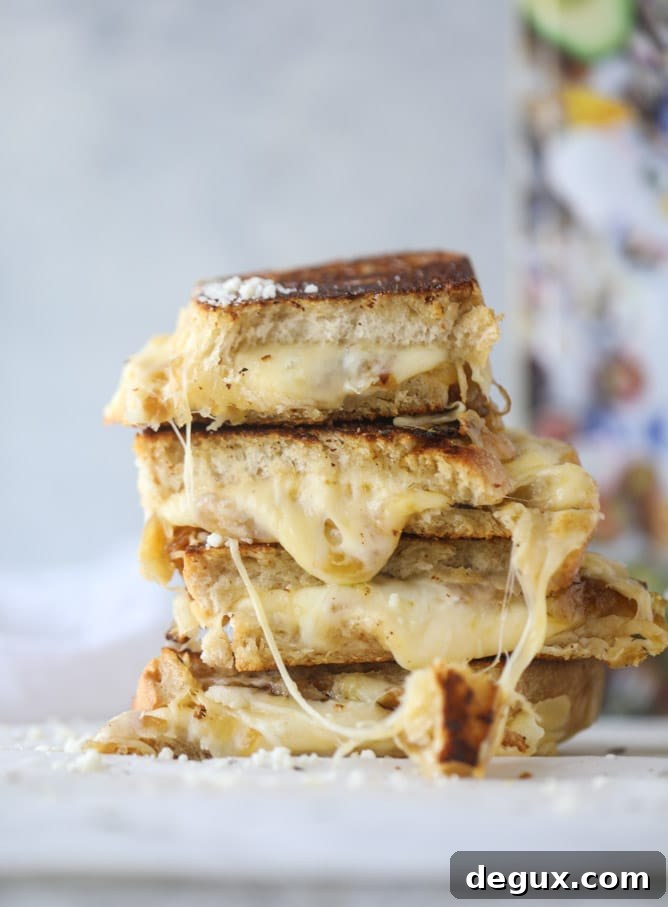 french onion grilled cheese with thyme butter I howsweeteats.com #grilledcheese #caramelizedonion #vegetarian