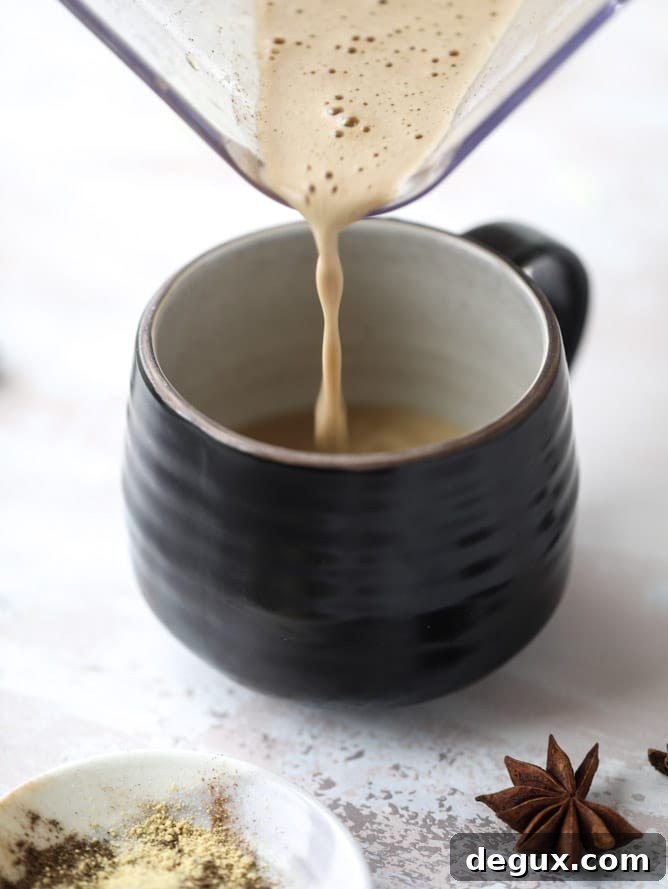 Coconut Chai Power Coffee: Energizing Spiced Coconut Latte Recipe 4 coconut chai power coffee I howsweeteats.com #coffee #coconut #chai #bulletproof #coconutoil