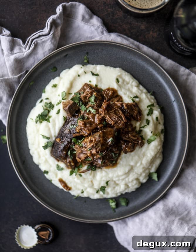 Guinness-Braised Short Ribs with Cheesy Cauliflower Mash 7 guinness short ribs with cheesy cauliflower mash I howsweeteats.com #slowcooker #guinness #shortribs #saintpatricksday #cauliflower