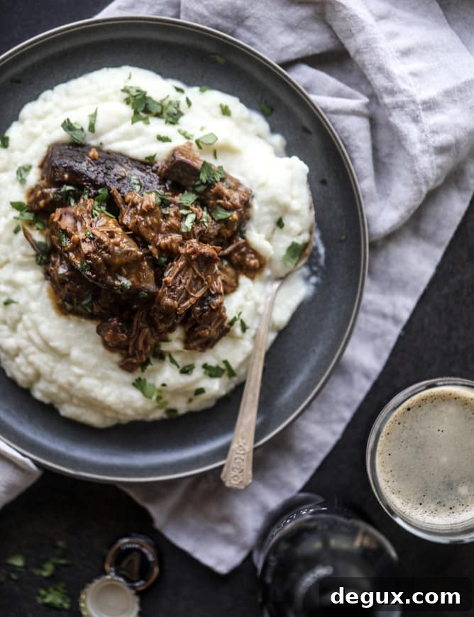 Guinness-Braised Short Ribs with Cheesy Cauliflower Mash 9 guinness short ribs with cheesy cauliflower mash I howsweeteats.com #slowcooker #guinness #shortribs #saintpatricksday #cauliflower