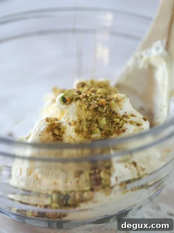Pistachio Carrot Cake with Cream Cheese Frosting Recipe 4 pistachio carrot cake with cream cheese frosting I howsweeteats.com #carrotcake #pistachio #cake #creamcheese #frosting