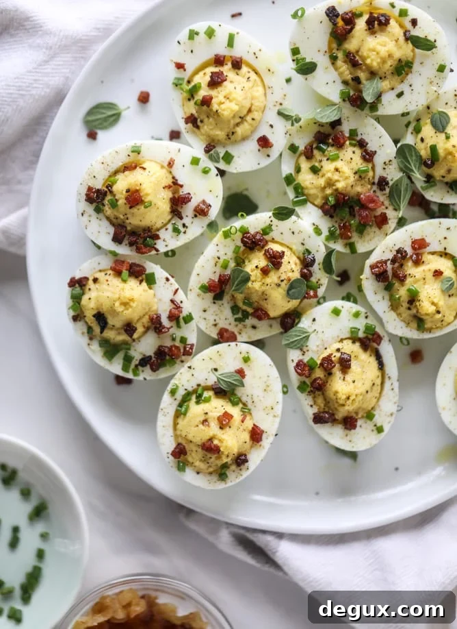 French Onion Deviled Eggs Recipe: Savory Appetizer with Caramelized Onions 11 french onion deviled eggs I howsweeteats.com #deviledeggs #frenchonion #easter #egg #recipes