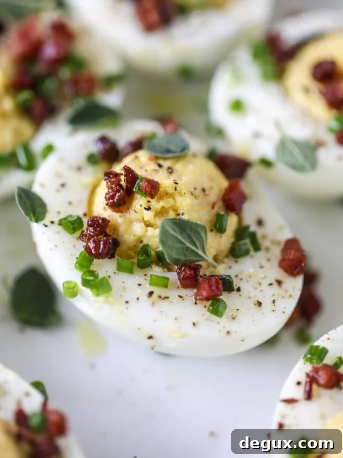 French Onion Deviled Eggs Recipe: Savory Appetizer with Caramelized Onions 3 french onion deviled eggs I howsweeteats.com #deviledeggs #frenchonion #easter #egg #recipes