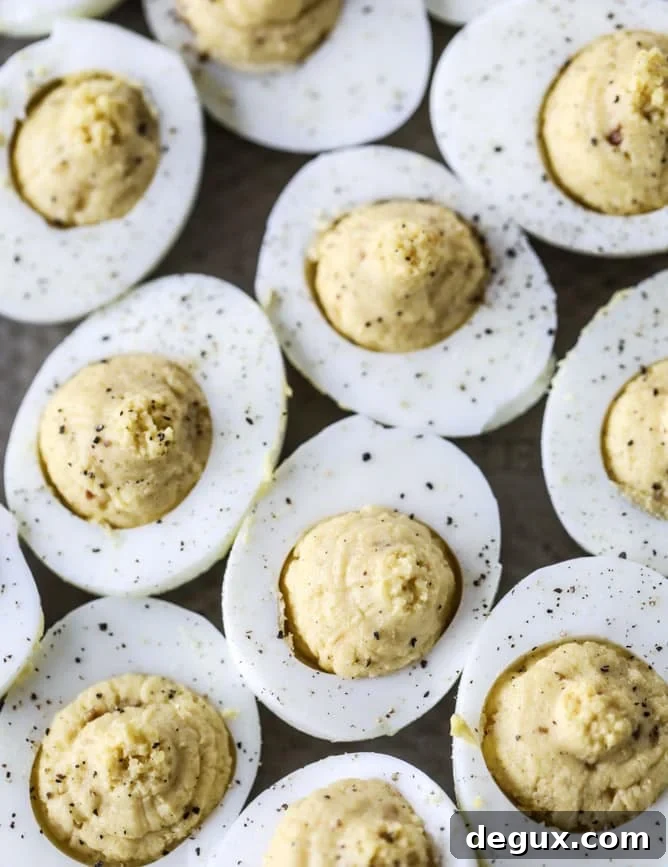 French Onion Deviled Eggs Recipe: Savory Appetizer with Caramelized Onions 5 french onion deviled eggs I howsweeteats.com #deviledeggs #frenchonion #easter #egg #recipes