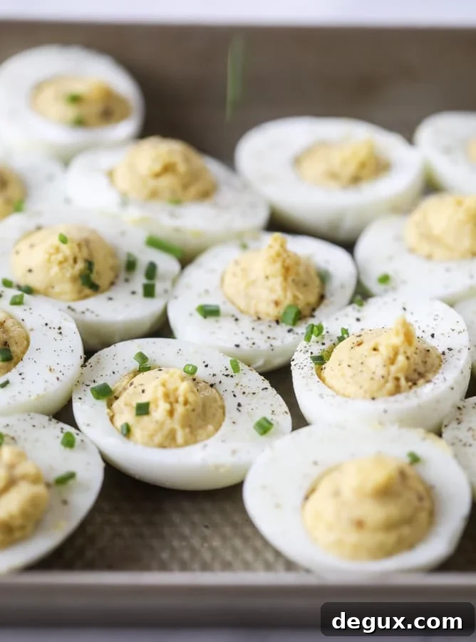 French Onion Deviled Eggs Recipe: Savory Appetizer with Caramelized Onions 6 french onion deviled eggs I howsweeteats.com #deviledeggs #frenchonion #easter #egg #recipes