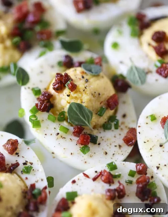 French Onion Deviled Eggs Recipe: Savory Appetizer with Caramelized Onions 9 french onion deviled eggs I howsweeteats.com #deviledeggs #frenchonion #easter #egg #recipes