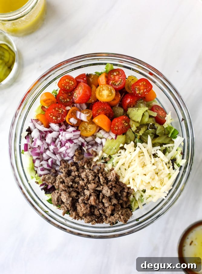 cheeseburger chopped salad I howsweeteats.com #cheeseburger #chopped #salad #dill #pickle #dressing