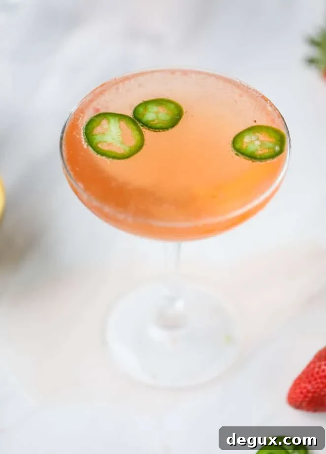 Strawberry Champagne Tequila Fizz Cocktail Recipe 2 strawberry champagne tequila fizz I howsweeteats.com #strawberry #champagne #tequila #cocktail #jalapeno