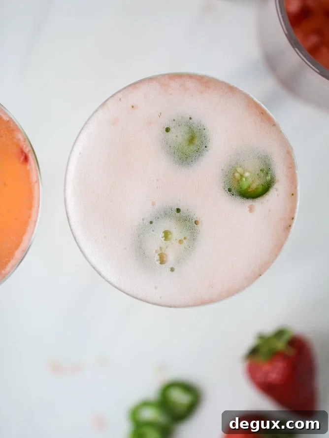strawberry champagne tequila fizz I howsweeteats.com #strawberry #champagne #tequila #cocktail #jalapeno