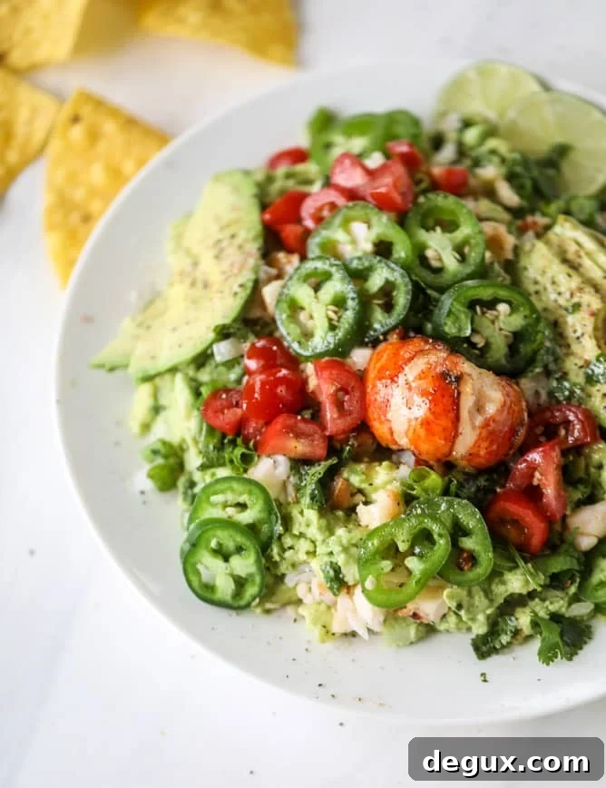 Lobster Guacamole Recipe: Creamy Lobster Avocado Dip for Parties 10 lobster guacamole I howsweeteats.com #lobster #guacamole #avocado #seafood #dip