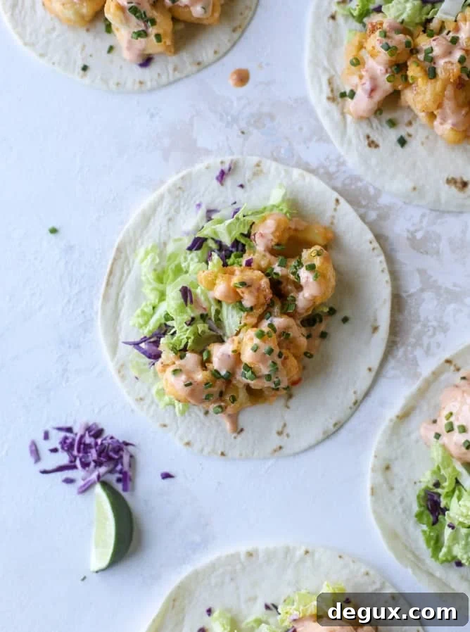 Spicy Bang Bang Cauliflower Tacos with Creamy Sriracha Sauce 5 bang bang cauliflower tacos I howsweeteats.com #bangbang #cauliflower #tacos #vegetarian