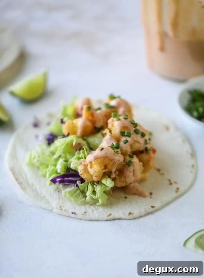 Spicy Bang Bang Cauliflower Tacos with Creamy Sriracha Sauce 6 bang bang cauliflower tacos I howsweeteats.com #bangbang #cauliflower #tacos #vegetarian