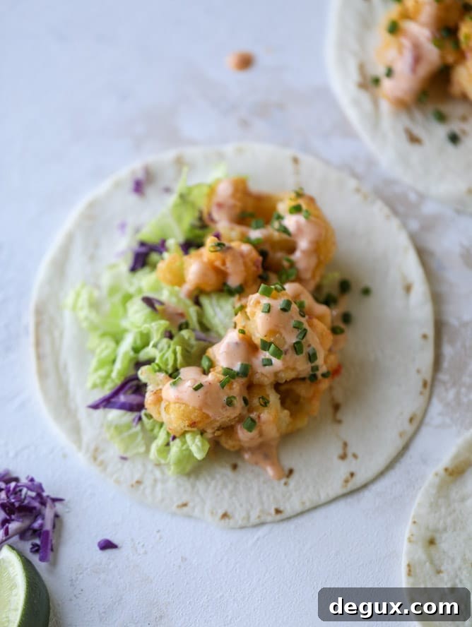 Bang Bang Cauliflower Tacos Recipe — Spicy Crispy Plant-Based Tacos 7 bang bang cauliflower tacos I howsweeteats.com #bangbang #cauliflower #tacos #vegetarian