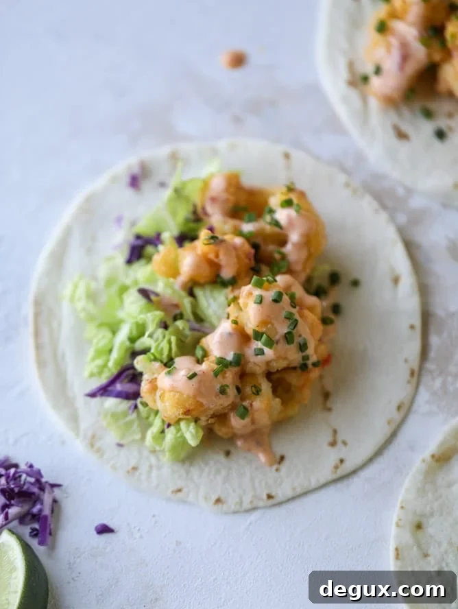 Spicy Bang Bang Cauliflower Tacos with Creamy Sriracha Sauce 7 bang bang cauliflower tacos I howsweeteats.com #bangbang #cauliflower #tacos #vegetarian