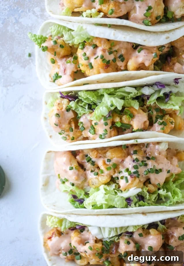 Spicy Bang Bang Cauliflower Tacos with Creamy Sriracha Sauce 10 bang bang cauliflower tacos I howsweeteats.com #bangbang #cauliflower #tacos #vegetarian