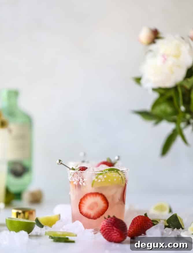 Smoked Strawberry Mezcal Margarita Recipe: Smoky Fruit Cocktail 2 smoked strawberry mezcal margaritas I howsweeteats.com #margaritas #mezcal #strawberry #lime