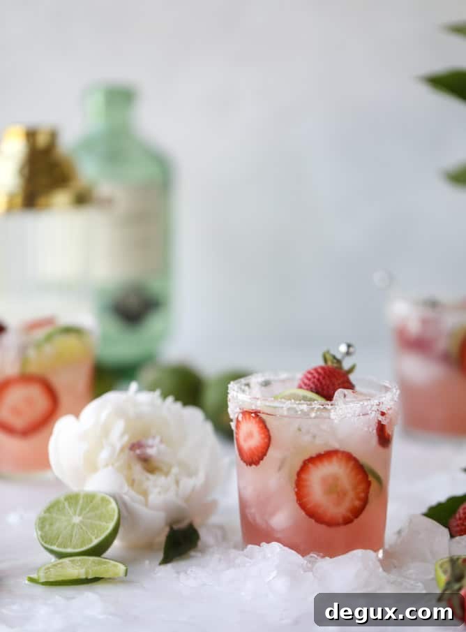Smoked Strawberry Mezcal Margarita Recipe: Smoky Fruit Cocktail 5 smoked strawberry mezcal margaritas I howsweeteats.com #margaritas #mezcal #strawberry #lime