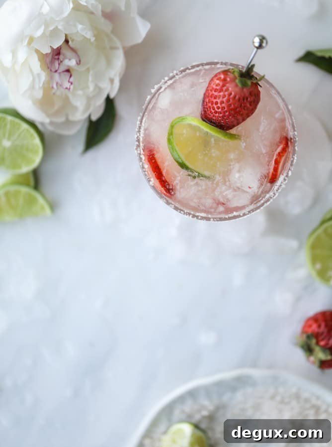 Smoked Strawberry Mezcal Margarita Recipe: Smoky Fruit Cocktail 6 smoked strawberry mezcal margaritas I howsweeteats.com #margaritas #mezcal #strawberry #lime