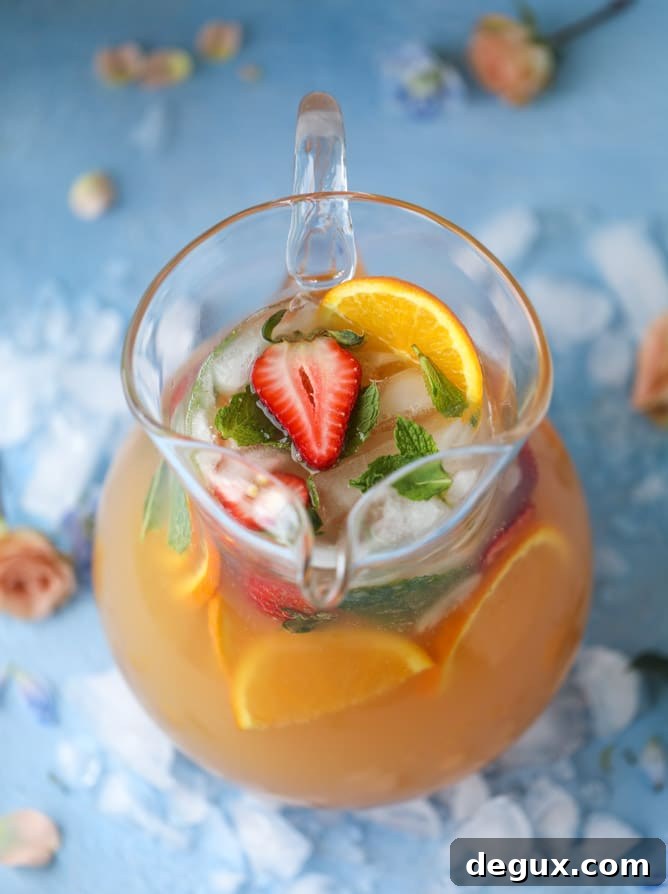 minted mimosa punch I howsweeteats.com #mimosa #punch #orangejuice #cocktails #champagne