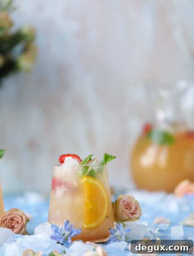 minted mimosa punch I howsweeteats.com #mimosa #punch #orangejuice #cocktails #champagne