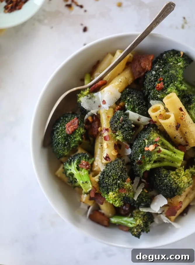 Weeknight Bacon and Broccoli Pasta Recipe 7 This is the easiest weeknight bacon broccoli pasta that can come together in minutes! Super flavorful and filled with crispy bacon, fresh broccoli, shaved parmesan and crushed red pepper, it's delicious on its own or as a base for more veggies or meat! I howsweeteats.com #bacon #broccoli #pasta #easy #dinner #recipes