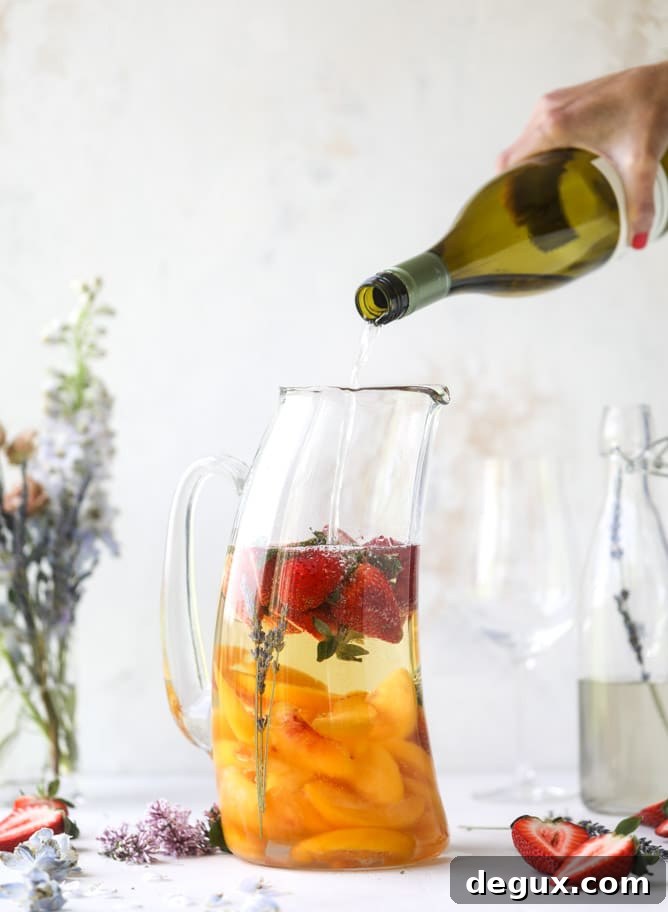Lavender Sangria Recipe: Floral Wine Punch for Entertaining 4 lavender sangria I howsweeteats.com #lavender #whitewine #sangria #cocktails