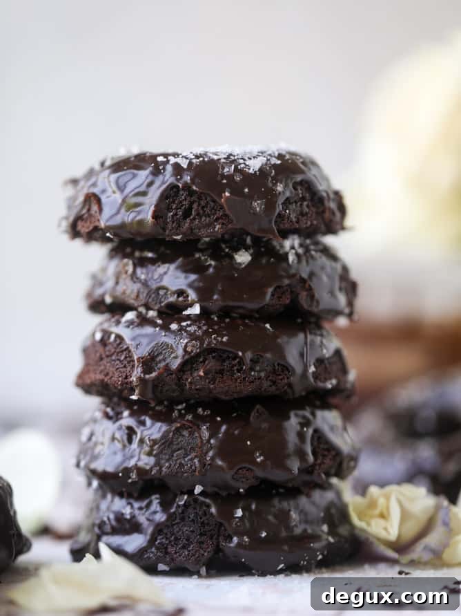 salted dark chocolate fudge donuts I howsweeteats.com #chocolate #donuts #doughtnuts #salted #fudge