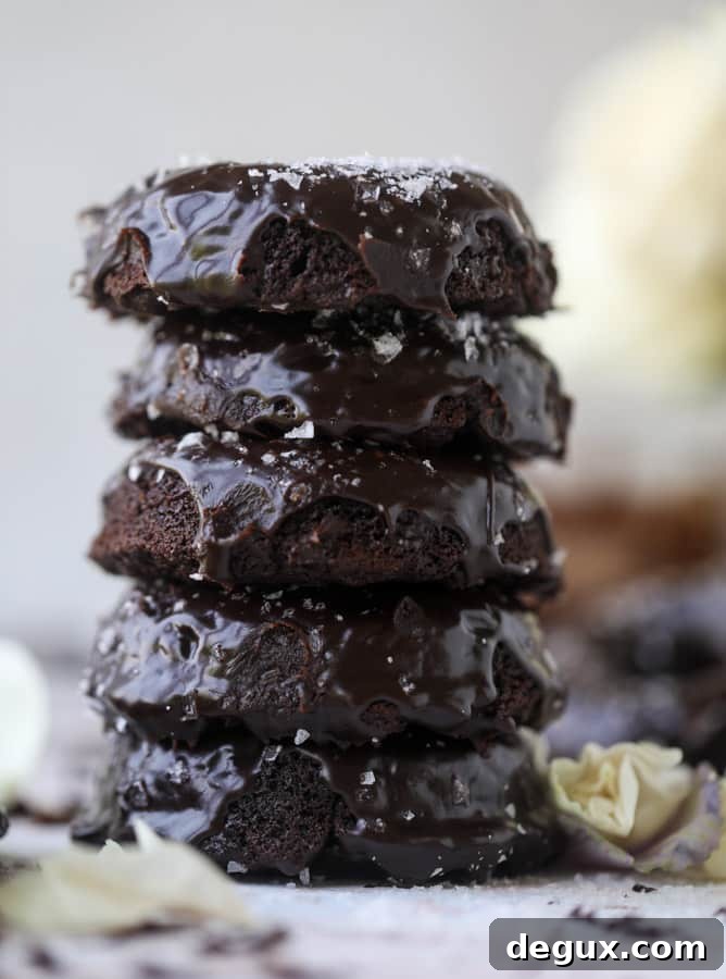 salted dark chocolate fudge donuts I howsweeteats.com #chocolate #donuts #doughtnuts #salted #fudge