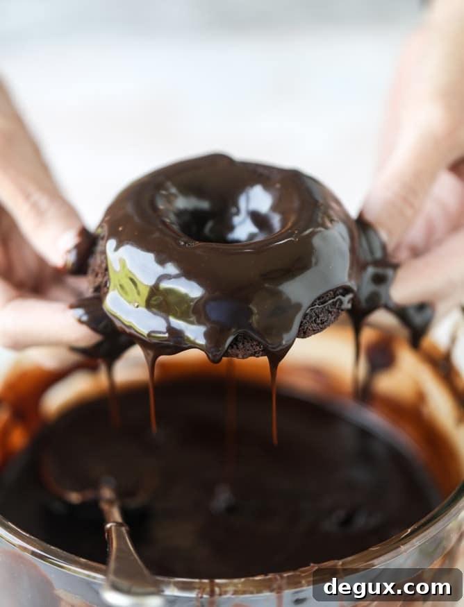 salted dark chocolate fudge donuts I howsweeteats.com #chocolate #donuts #doughtnuts #salted #fudge