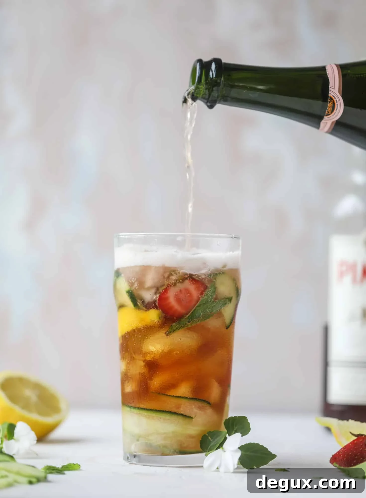 Sparkling Rosé Pimm’s Cups Recipe for Summer Cocktails 5 I love a delicious Pimm's Cup in the heart of summer! This was is topped with sparkling rosé wine and filled with strawberries, cucumbers and lemon wedges. It's super refreshing and perfect on hot hot days! I howsweeteats.com #pimms #cup #recipe #cocktails #rosé #sparkling #summer
