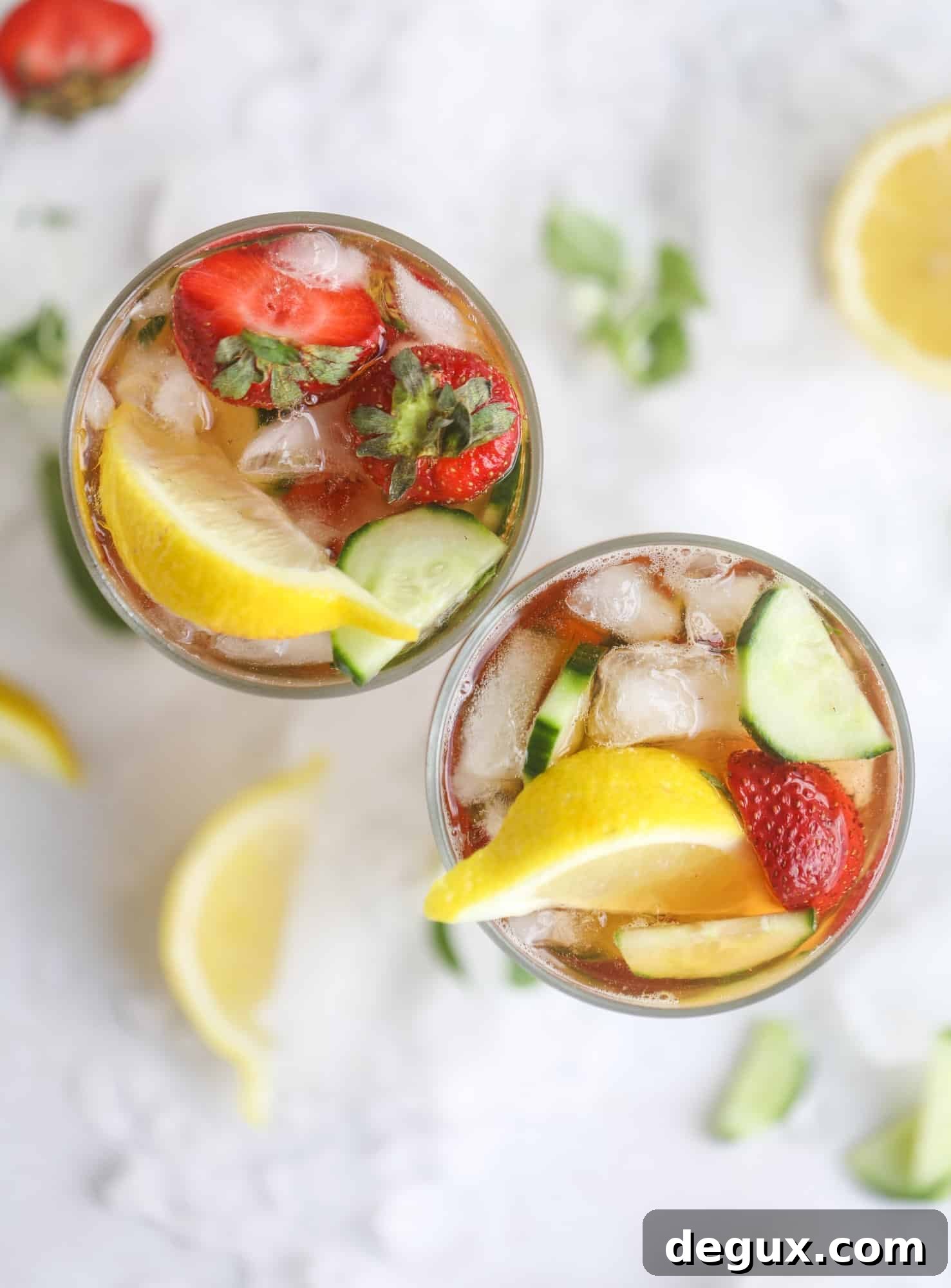 Sparkling Rosé Pimm’s Cups Recipe for Summer Cocktails 7 I love a delicious Pimm's Cup in the heart of summer! This was is topped with sparkling rosé wine and filled with strawberries, cucumbers and lemon wedges. It's super refreshing and perfect on hot hot days! I howsweeteats.com #pimms #cup #recipe #cocktails #rosé #sparkling #summer