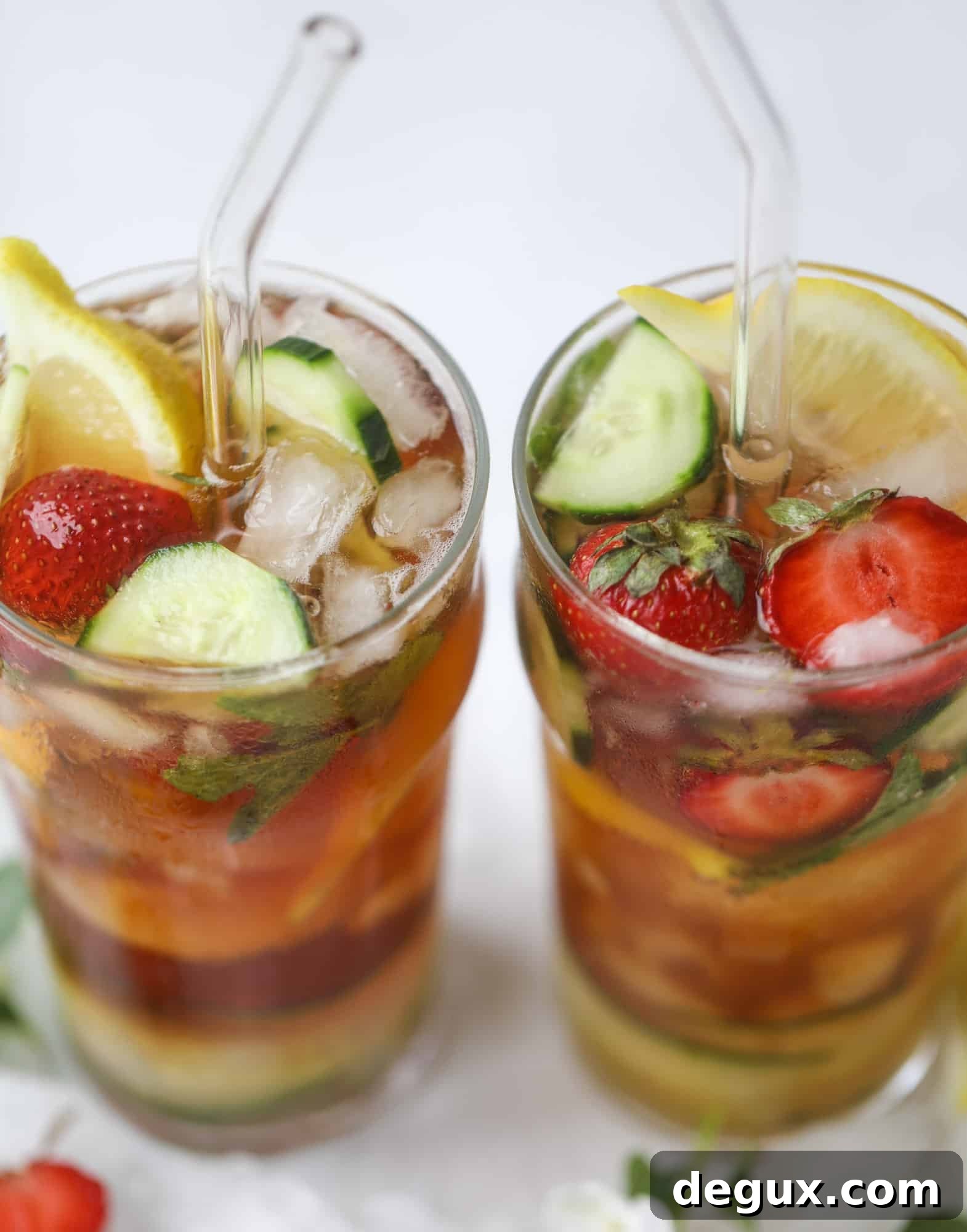 Sparkling Rosé Pimm’s Cups Recipe for Summer Cocktails 10 I love a delicious Pimm's Cup in the heart of summer! This was is topped with sparkling rosé wine and filled with strawberries, cucumbers and lemon wedges. It's super refreshing and perfect on hot hot days! I howsweeteats.com #pimms #cup #recipe #cocktails #rosé #sparkling #summer