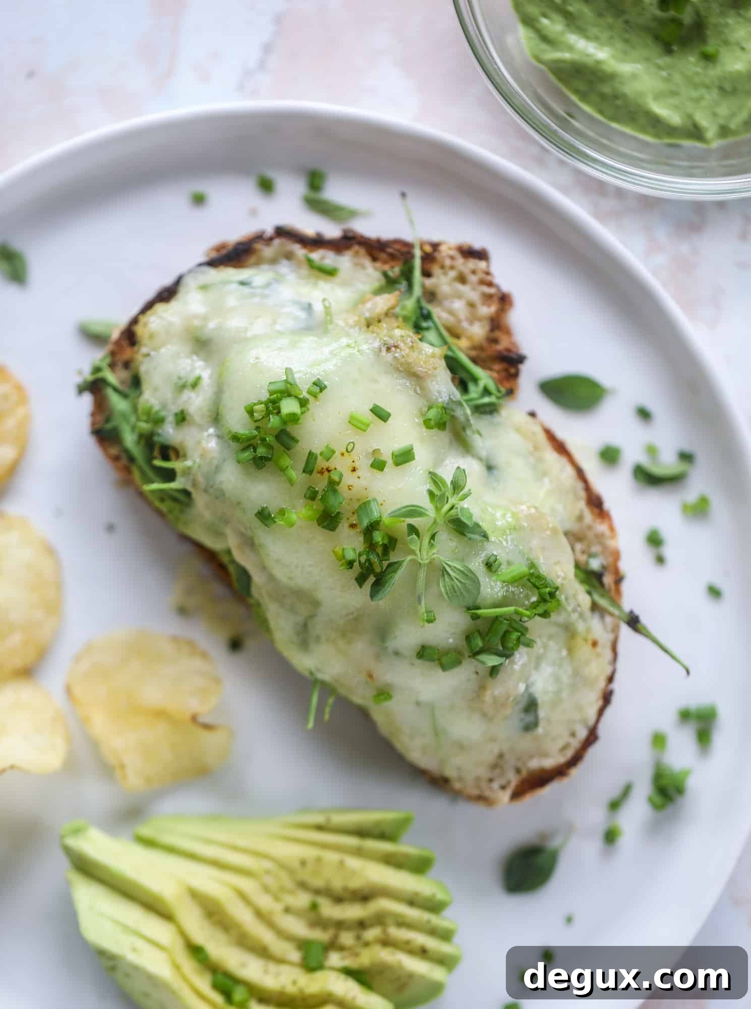 These green green tuna melt tartines are a lunch dream come true! The green goddess dressing is full of avocado, greek yogurt, spinach and fresh herbs. Paired with the tuna, whole grain toast and melty cheese, it's incredibly delicious and a super easy lunch! I howsweeteats.com #green #goddess #tune #salad #melts