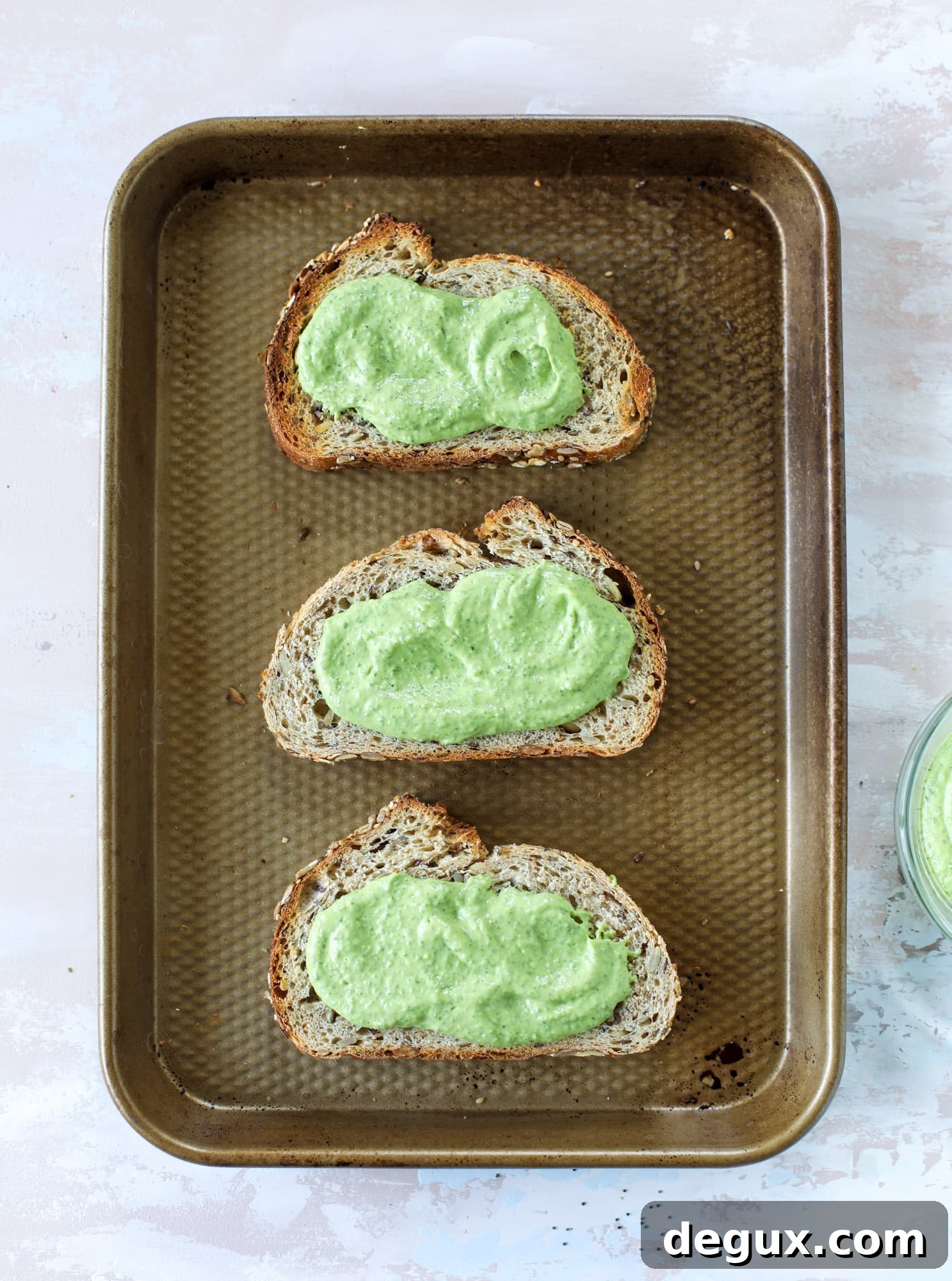 These green green tuna melt tartines are a lunch dream come true! The green goddess dressing is full of avocado, greek yogurt, spinach and fresh herbs. Paired with the tuna, whole grain toast and melty cheese, it's incredibly delicious and a super easy lunch! I howsweeteats.com #green #goddess #tune #salad #melts