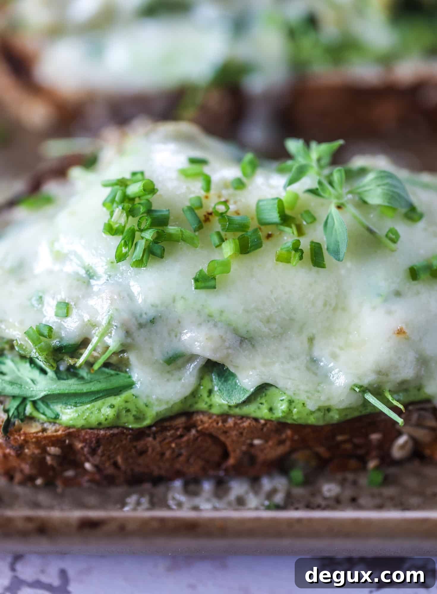 These green green tuna melt tartines are a lunch dream come true! The green goddess dressing is full of avocado, greek yogurt, spinach and fresh herbs. Paired with the tuna, whole grain toast and melty cheese, it's incredibly delicious and a super easy lunch! I howsweeteats.com #green #goddess #tune #salad #melts