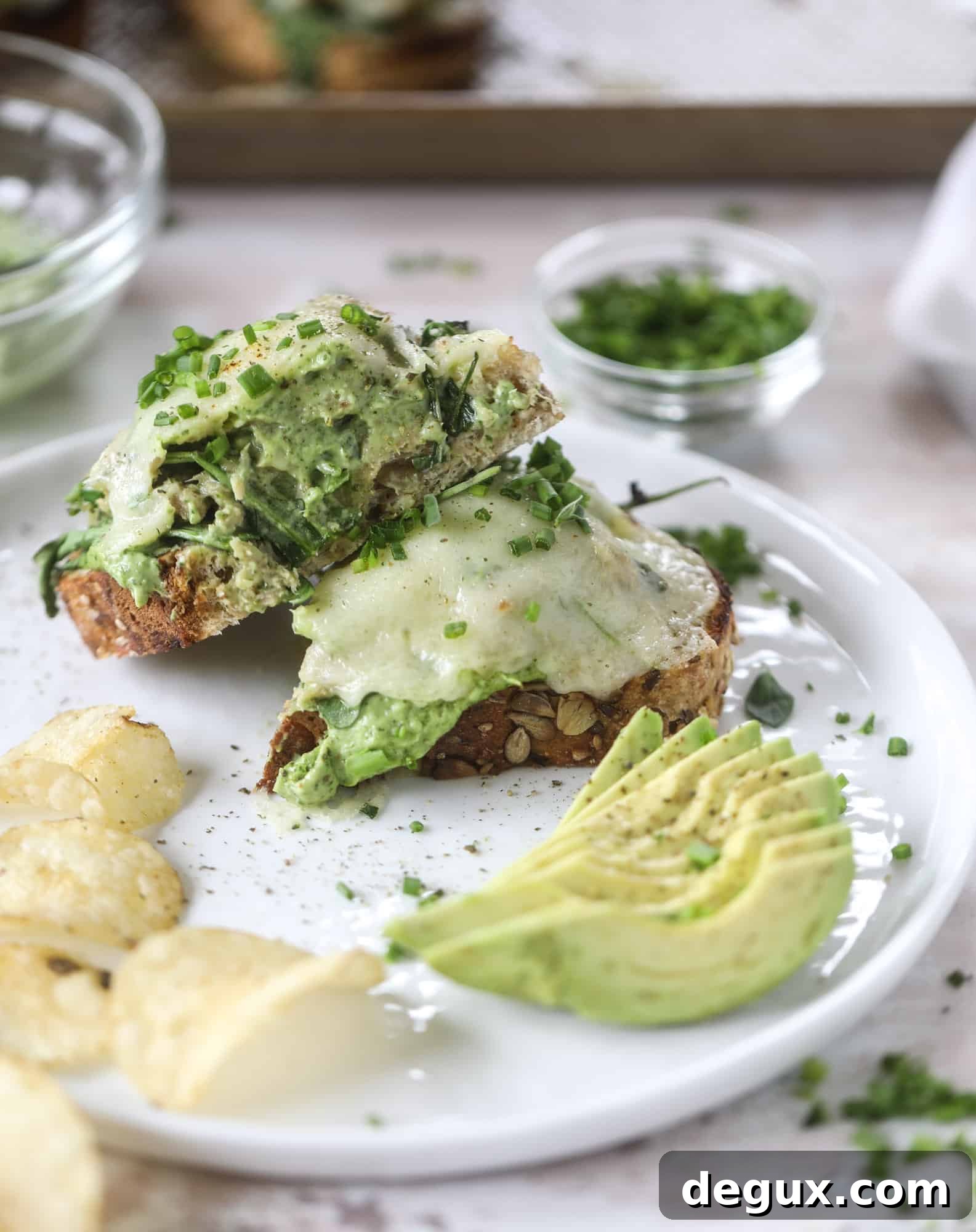 These green green tuna melt tartines are a lunch dream come true! The green goddess dressing is full of avocado, greek yogurt, spinach and fresh herbs. Paired with the tuna, whole grain toast and melty cheese, it's incredibly delicious and a super easy lunch! I howsweeteats.com #green #goddess #tune #salad #melts